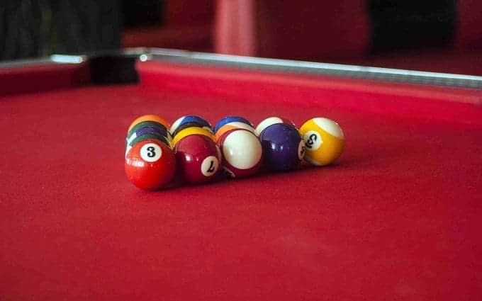 Balls On Pool Table With Red Felt